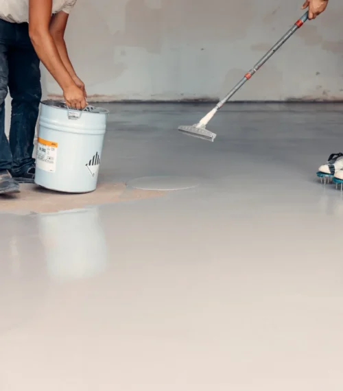 concrete contractor working on garage floor in cedar rapids
