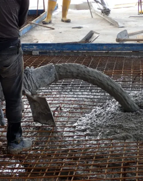 concrete-specialist-are-pumping-concrete-for-a-foundation-of-abuilding-cedar-rapids-iowa concrete contractors are pumping concrete for a foundation in cedar rapids